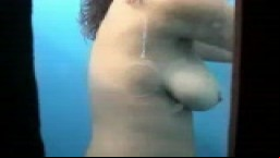 Busty Milf in beach cabin hidden cam